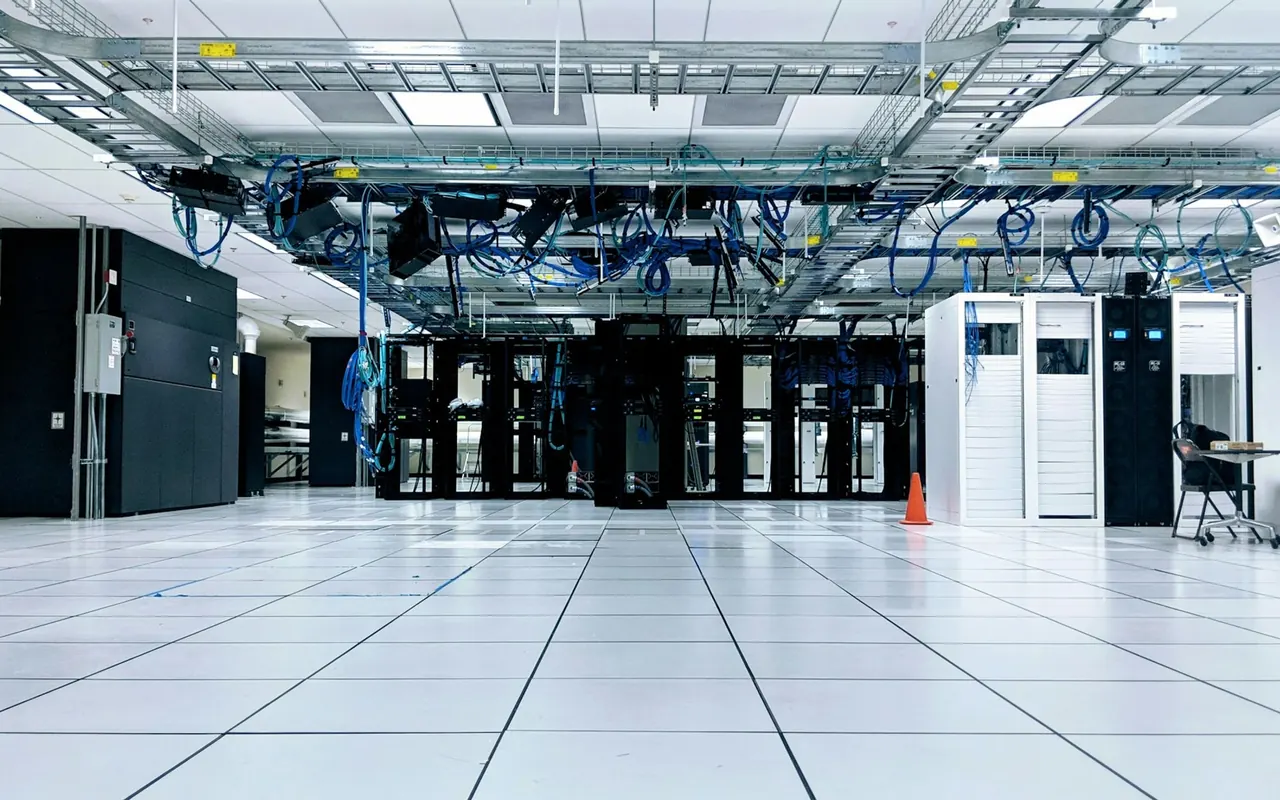 Rows of server cabinets in a data center hall