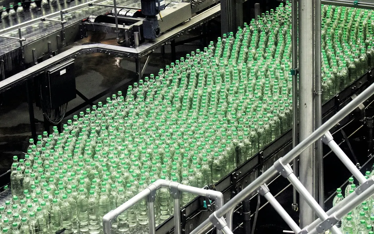 Glass bottles moving along a bottling line